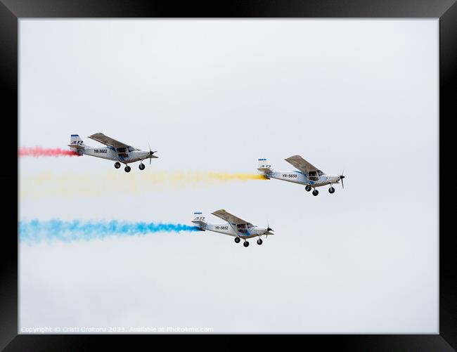  Light airplane leaving colorful contrails  Framed Print by Cristi Croitoru