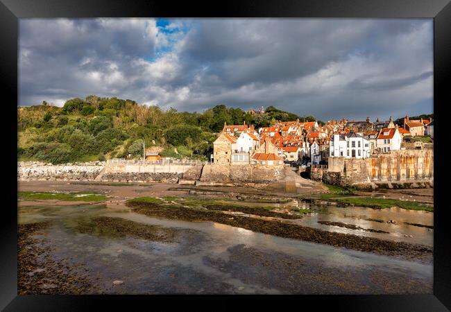 Moody skies over Robin Hoods Bay Framed Print by Tim Hill