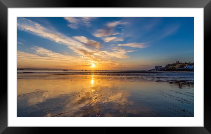 Sunrise reflections at low tide at Tenby in Wales Framed Mounted Print by Tim Hill