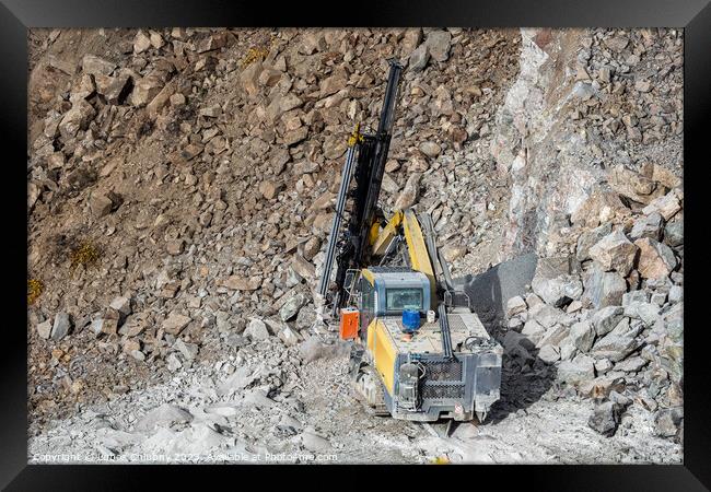 Drilling machine in open cast mining quarry Framed Print by Lubos Chlubny