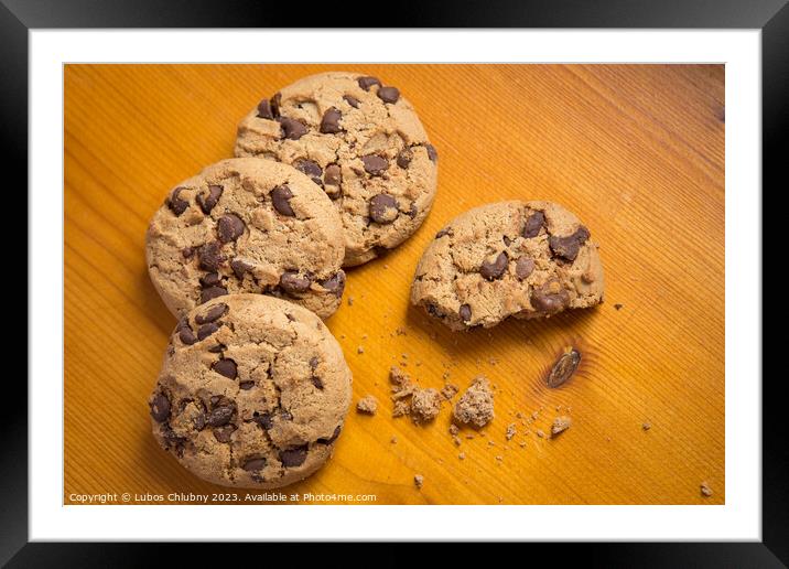 Chocolate chip cookies on wood background. Framed Mounted Print by Lubos Chlubny