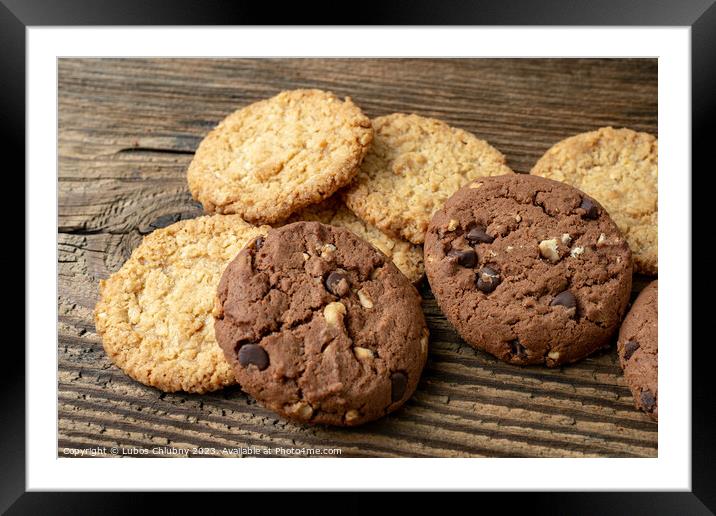 Various tasty cookies biscuits on wooden background Framed Mounted Print by Lubos Chlubny