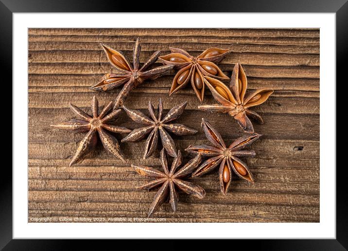 Dried star anise spice on vintage wooden board Framed Mounted Print by Lubos Chlubny