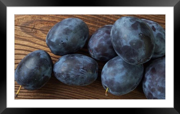 Tasty and ripe plums on brown wooden table Framed Mounted Print by Irena Chlubna
