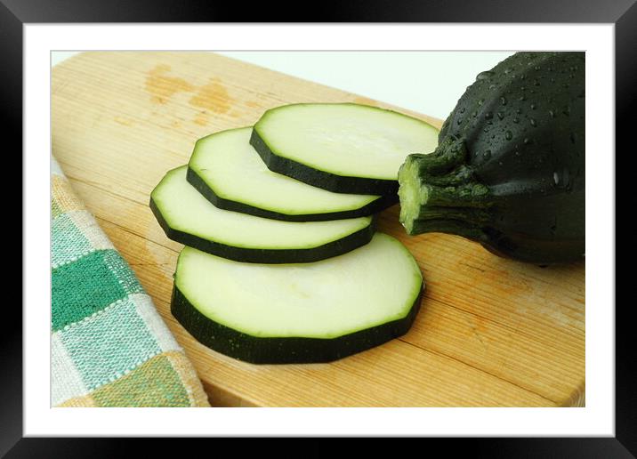 Close up of sliced zucchini on wooden cutting board Framed Mounted Print by Irena Chlubna