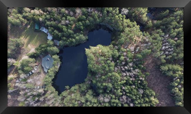 Lake surrounded by trees. Beautiful landscape in aerial drone shot. Framed Print by Irena Chlubna