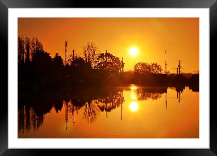 Sunrise reflections over St Osyth Boatyard in essex  Framed Mounted Print by Tony lopez