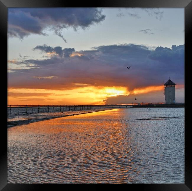 Sun setting over the tidal pool in Brightlingsea  Framed Print by Tony lopez