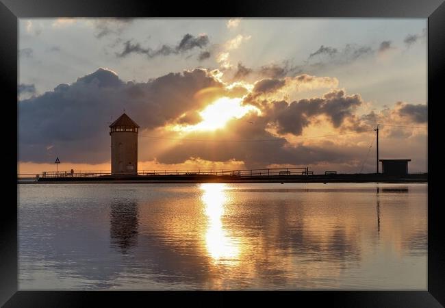 Sun setting over Batemans Tower in Brightlingsea  Framed Print by Tony lopez