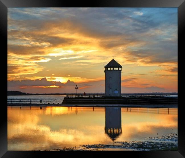  Sun set reflections over the Brightlingsea tidal pool  Framed Print by Tony lopez