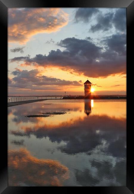 Peaceful reflections over Batemans Tower in Brightlingsea  Framed Print by Tony lopez