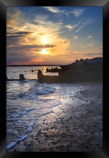 Sunsetting under the storm clouds over Brightlingsea beach  Framed Print by Tony lopez