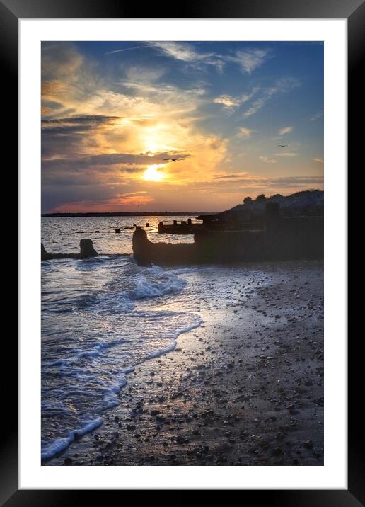 Sunsetting under the storm clouds over Brightlingsea beach  Framed Mounted Print by Tony lopez