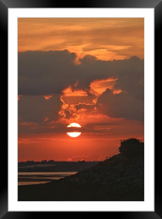 Sun setting over Brightlingsea beach  Framed Mounted Print by Tony lopez