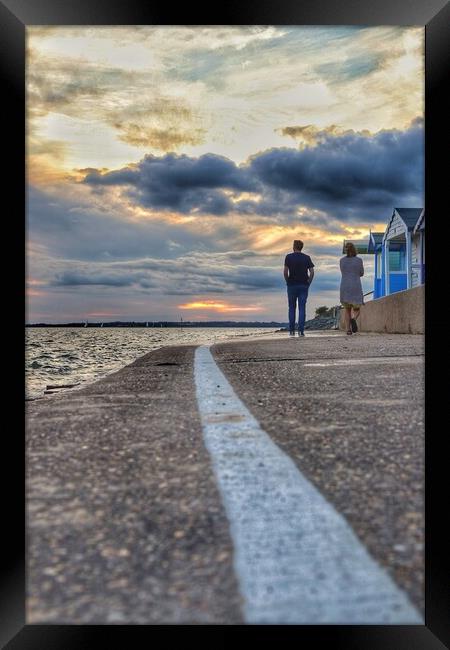 Walking into the  sunset colours across the river Colne In  Brightlingsea.  Framed Print by Tony lopez
