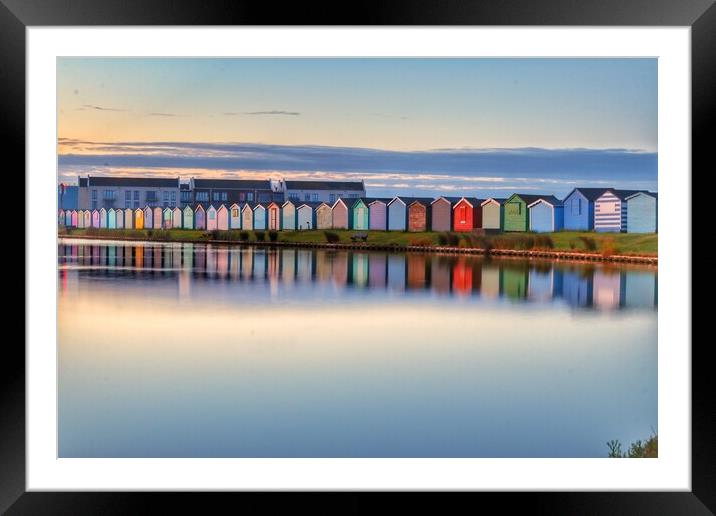 Sunrise reflections along the beach huts  Framed Mounted Print by Tony lopez