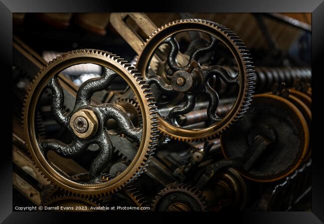 Cogs on the machine Framed Print by Darrell Evans