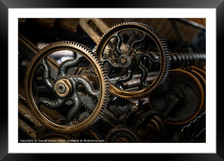 Cogs on the machine Framed Mounted Print by Darrell Evans