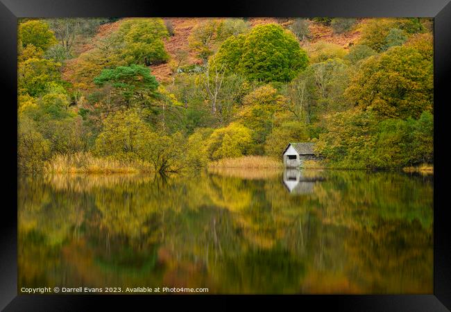 Autumn trees and boathouse Framed Print by Darrell Evans