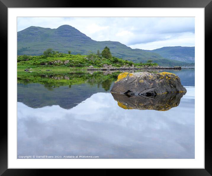 Rock in calm waters Framed Mounted Print by Darrell Evans