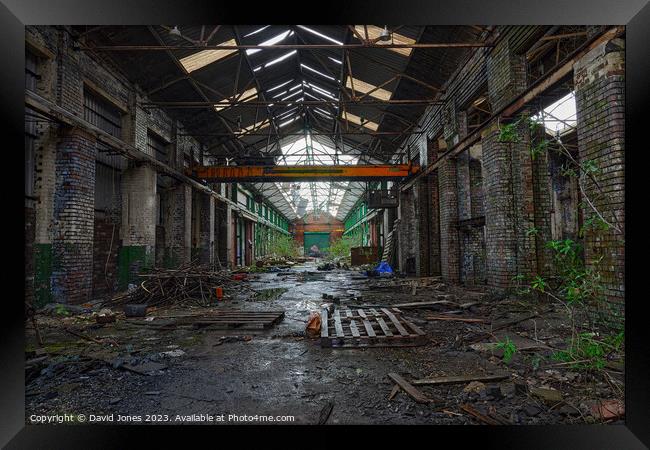 Abandoned warehouse with overhead crane Framed Print by David Jones