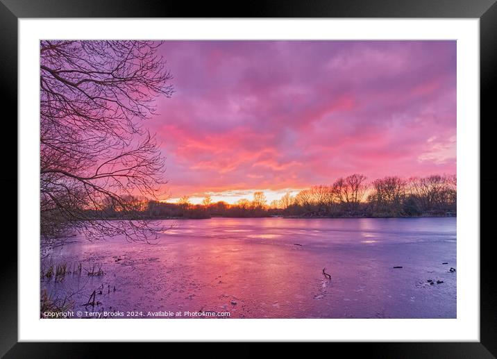 Sunset over Frozen Lake Framed Mounted Print by Terry Brooks