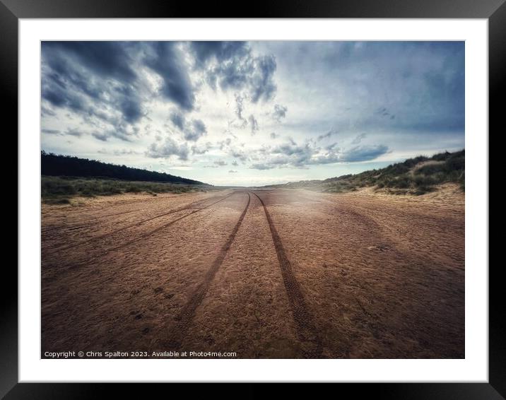 Tracks in the sand across a beach Framed Mounted Print by Chris Spalton