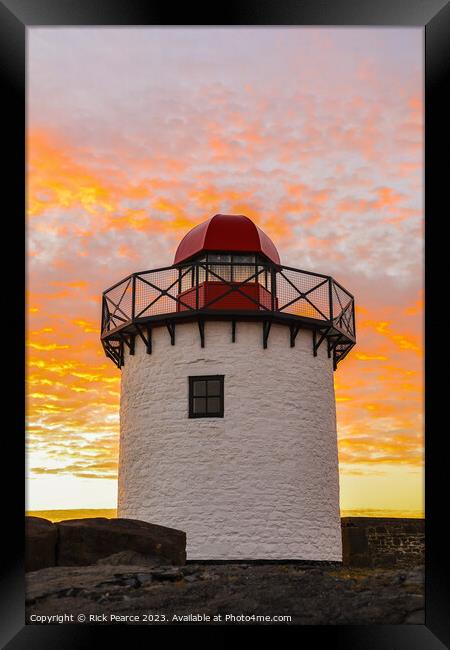 Bury port lighthouse at sunset Framed Print by Rick Pearce