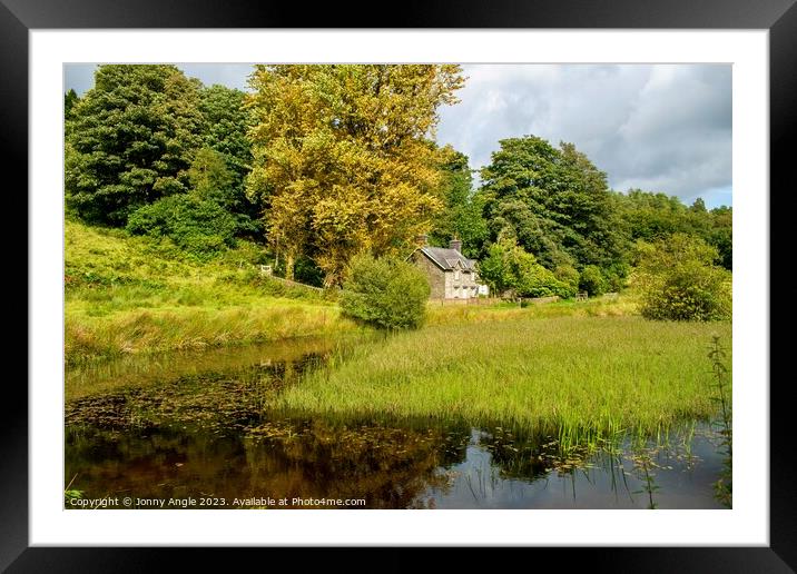 Romantic cottage in trees with water reflecting light  Framed Mounted Print by Jonny Angle