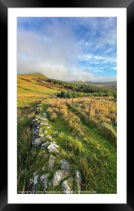 misty sunrise over stone wall and mountains  Framed Mounted Print by Jonny Angle