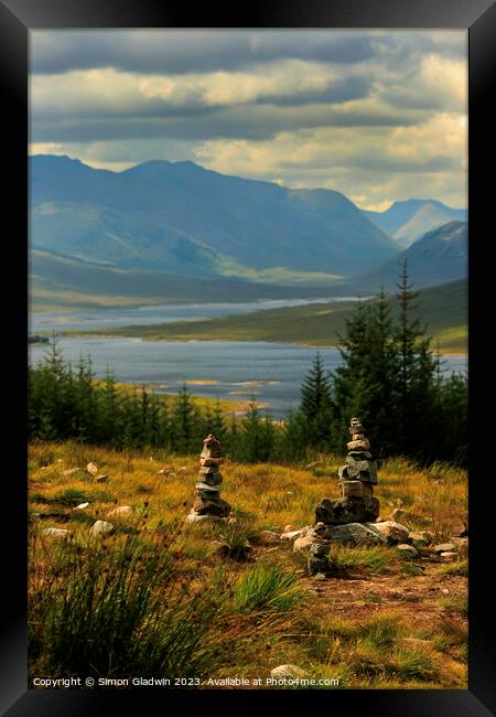 Stone Stacks at The 5 Sisters of Kintail Framed Print by Simon Gladwin