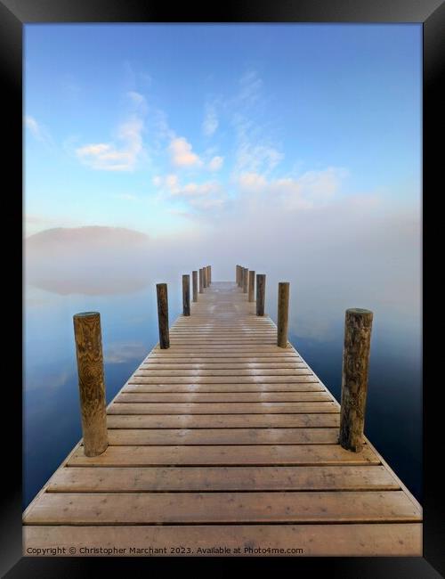 A jetty leading into the foggy lake Ullswater  Framed Print by Christopher Marchant