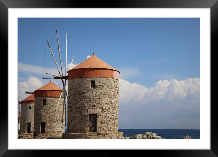 Windmills at the seafront in the city of Rhodes in Rhodes island in Greece Framed Mounted Print by Virginija Vaidakaviciene