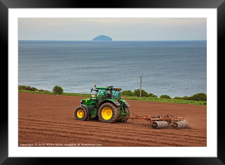 Tractor preparing field for crop planting, Ayrshir Framed Mounted Print by Arch White