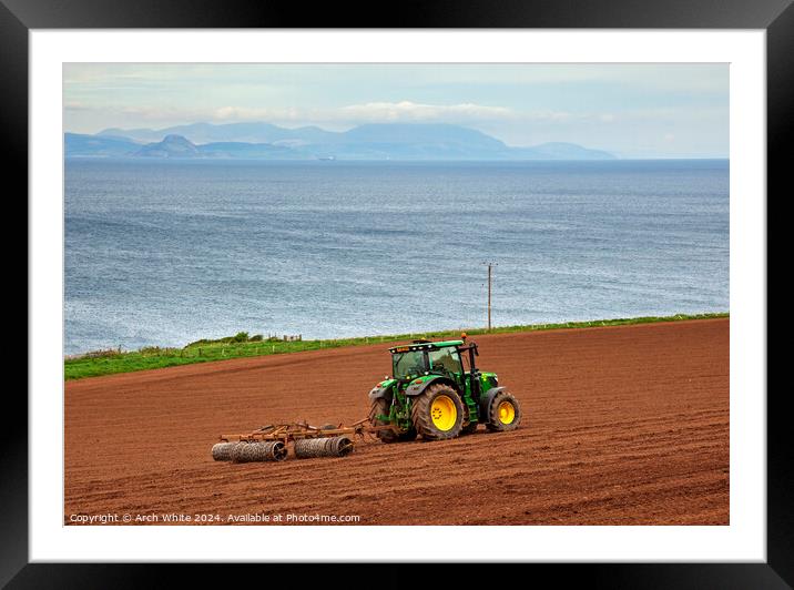 Tractor preparing field for crop planting, Ayrshir Framed Mounted Print by Arch White
