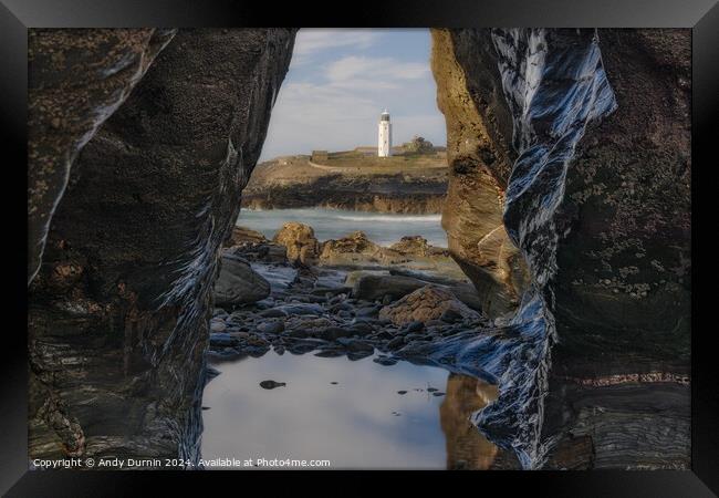Godrevy's Glimpse: Lighthouse Beyond the Rocky Portal Framed Print by Andy Durnin