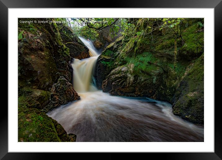 A large waterfall in a forest Framed Mounted Print by A Chisholm