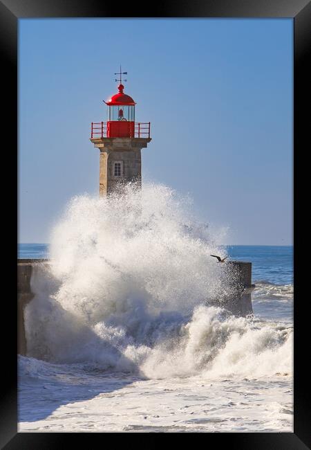 Storm waves over the Lighthouse Framed Print by Olga Peddi