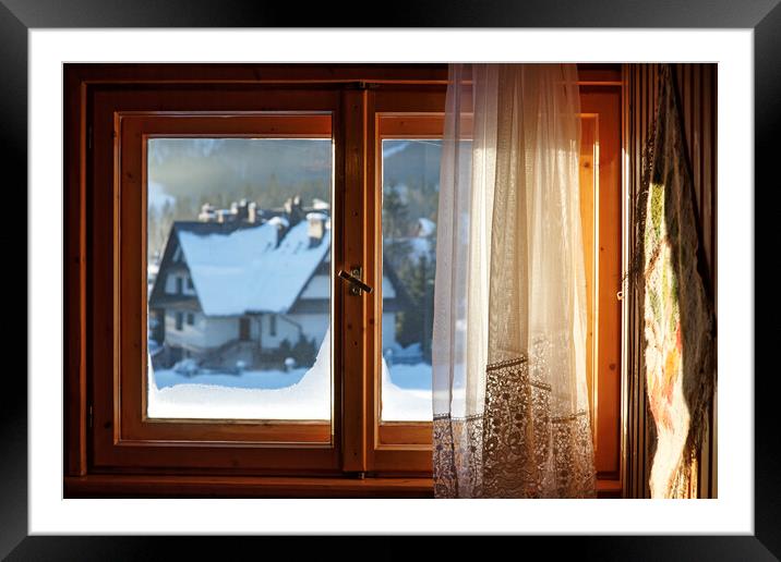 Beautiful view from window on winter village with  Framed Mounted Print by Olga Peddi