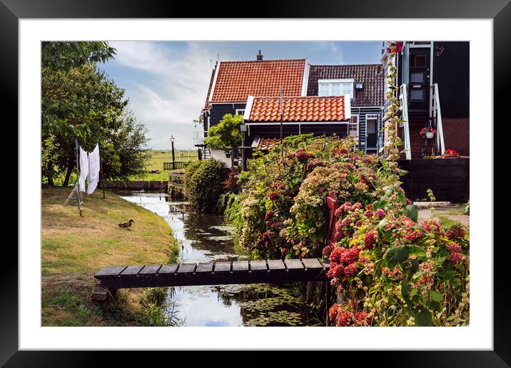 Traditional dutch Village with with colorful house Framed Mounted Print by Olga Peddi