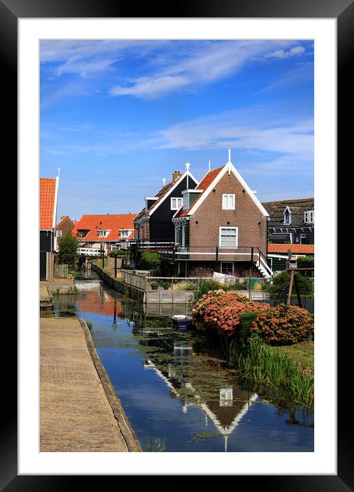 Traditional dutch Village with with colorful house Framed Mounted Print by Olga Peddi