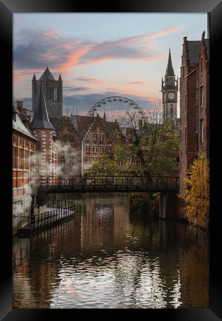View of canals and streets of Gent town, Belgium i Framed Print by Olga Peddi