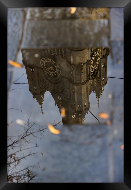 Reflection of the highest part of the clock tower. Framed Print by Olga Peddi