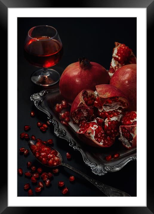 Still life of pomegranates on a black background Framed Mounted Print by Olga Peddi