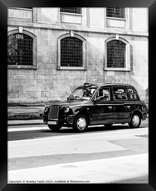 Iconic Black London Taxi in Black and White Framed Print by Bradley Taylor