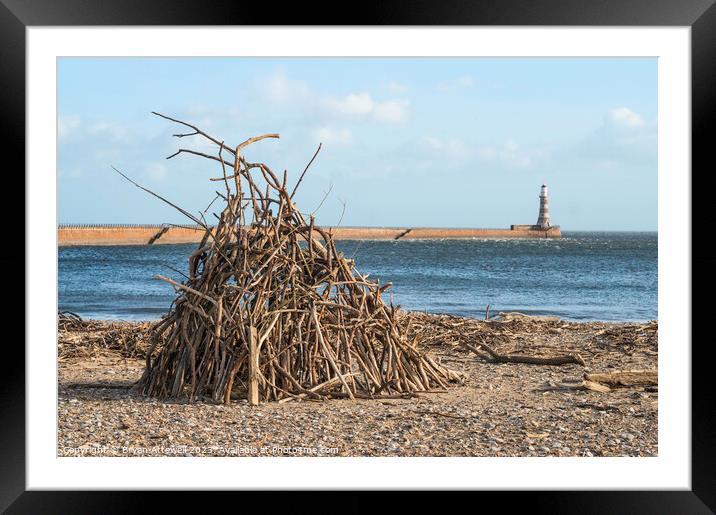 Driftwood stack on Roker beach  Framed Mounted Print by Bryan Attewell