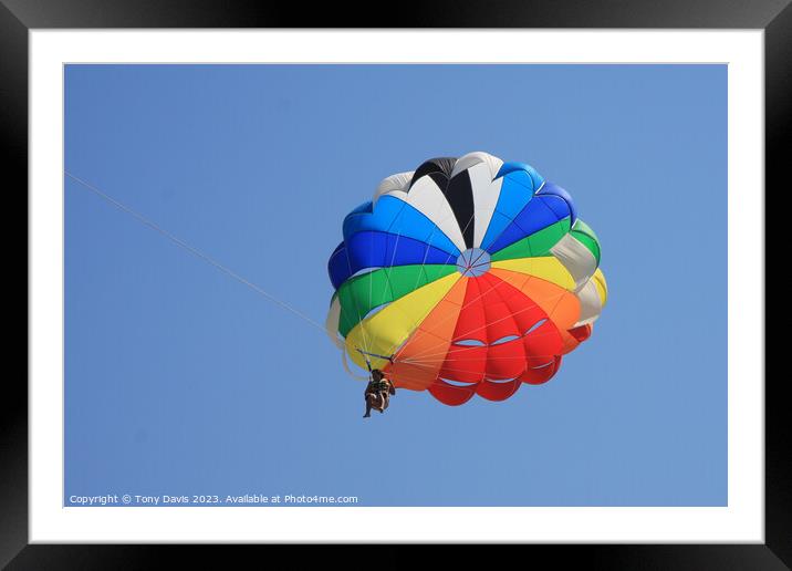 Parachute on a clear blue sky Framed Mounted Print by Tony Davis
