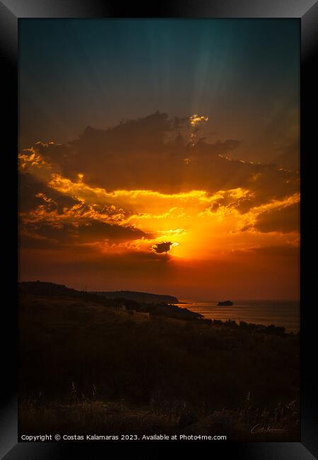 Sunrise behind the clouds Framed Print by Costas Kalamaras