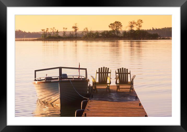 chairs on dock next to classic boat Framed Mounted Print by Dave Reede