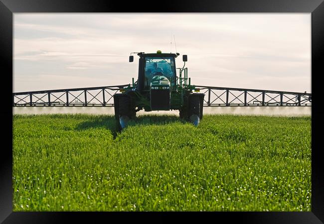 spraying wheat Framed Print by Dave Reede